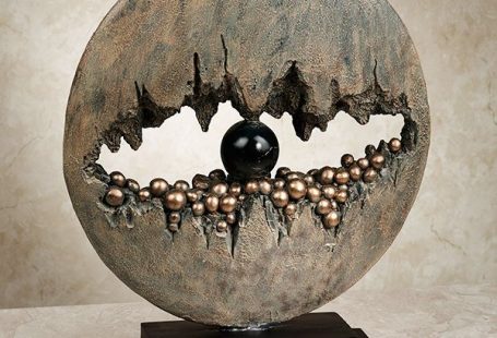 This piece could be a representation of an eye and the way the negative space makes the Sculpture look more interesting