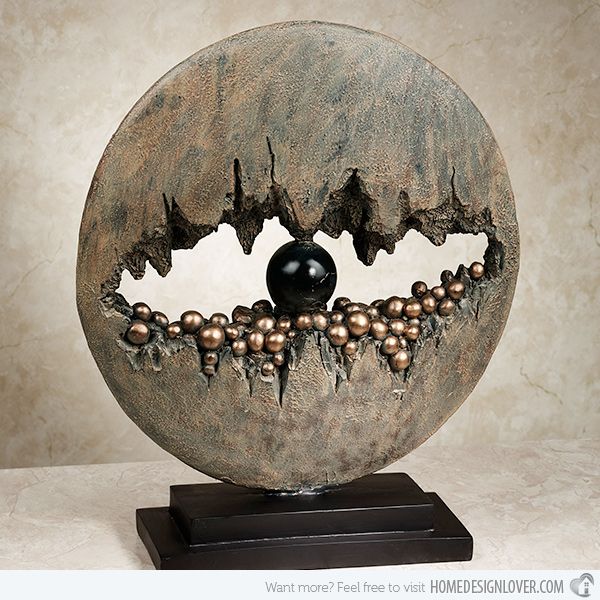 This piece could be a representation of an eye and the way the negative space makes the Sculpture look more interesting