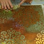 Artist working with Stencil Impressions