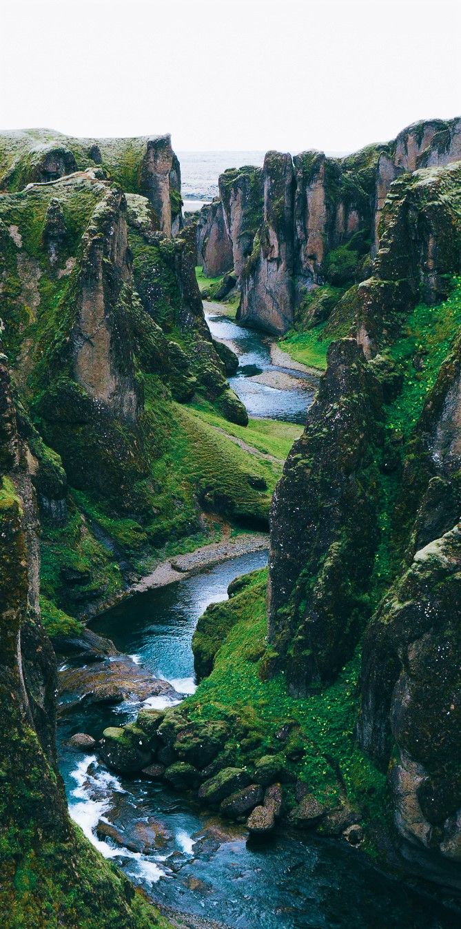 With soaring cliffs and a river rushing through it, the Fjaðrárgljúfur Canyon is one of the most incredible places in all of Iceland. Read through our Iceland travel guide with all the top landscape locations to photograph and visit on a road trip through Iceland!