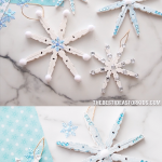 CLOTHESPIN SNOWFLAKE CRAFT - this easy Christmas ornament craft is just made with clothespins! Glue them together to make beautiful snowflakes to hang on your Christmas tree.