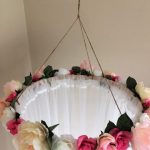 This beautiful hand crafted, floral canopy would be a gorgeous addition to a little girls room, above her bed or as a whimsical reading nook. Would also be perfect for a photography prop, in a bridal shoot or with a sweet newborn propped on a pile of soft blankets or pillows. The canopy drapes measure 98 long and hang from an additional 20 of twine, making the total length 118. The hoop has 110 of material gathered around it and measures 58 around and the measurement with the flowers is appro...