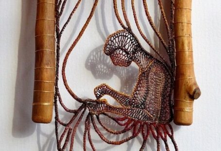 Artist Ágnes Herczeg combines delicate lace art with the knotty branches of found wood to create scenes depicting the contemplative beauty of humanity.