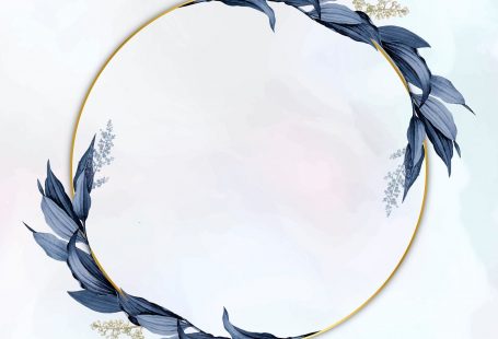Gold circle frame decorated with blue leaves on a white paint brushstroke background
