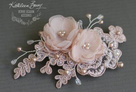 A dainty Lace detail to finish off any wedding hairstyle or bridesmaid gift. I have used corded bridal lace, handmade organza flowers with clear crystal and matching Czech pearl detailing on silver plated wirework. (priced per unit) This hairpiece attaches with a crocodile style