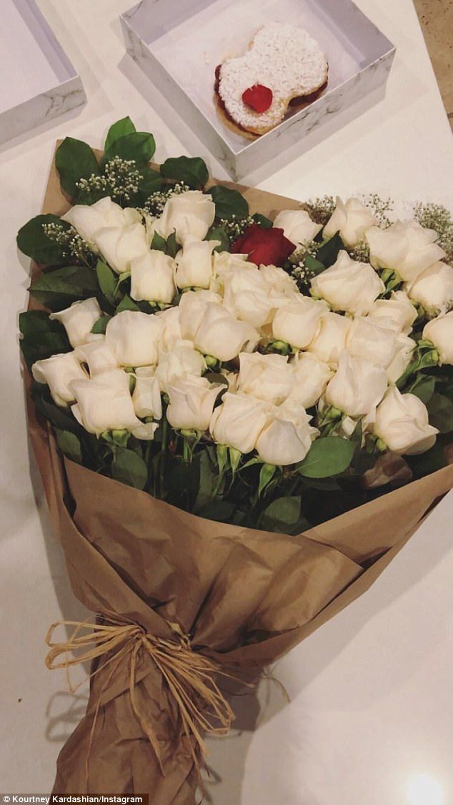 Meanwhile: Kourtney Kardashian showed off her beautiful bouquet of white roses