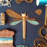 Bedford, England-based embroidery artist Humayrah Bint Altaf (previously) continues to construct ornate insects using shimmering threads and metallic beads. Her dragonflies, bees, beetles, and butterflies take shape using carefully paired patterns and colors that form wings, bodies, and even delicat