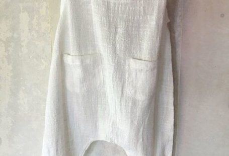 Pretty white boho baby romper in soft cotton or linen.