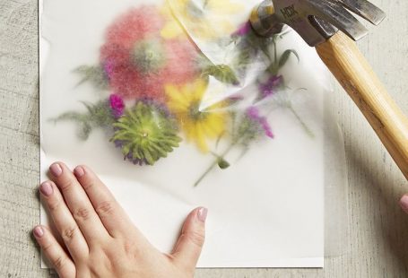 smashing flowers with hammer for coloring paper