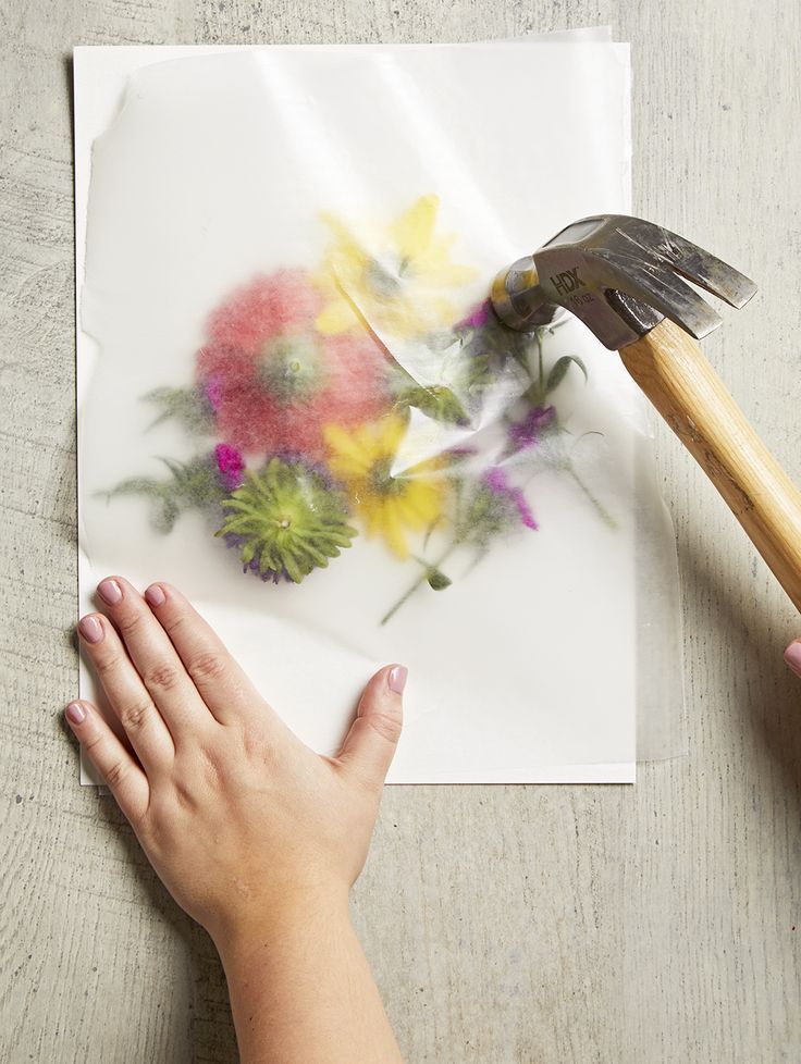 smashing flowers with hammer for coloring paper