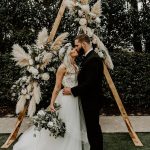 Karlee and Stew’s trendy + boho wedding featuring timeless whites and muted greens leaves a wide smile on our face. Because why not? It