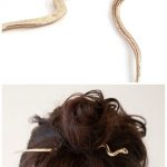 Mokao snake hairpin by Leo Black. In brass, with garnet eyes.