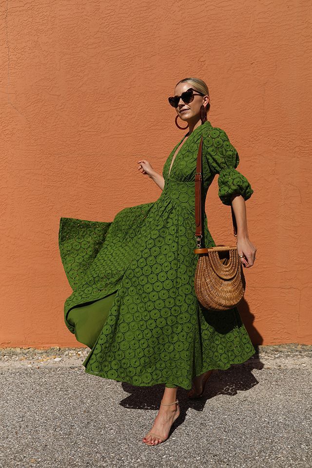 Blair Eadie wearing a Cult Gaia eyelet dress with a Staud straw bag and Lele Sadoughi hoop earrings // Sunglasses by Saint Laurent // Click through for more vacation style and warm weather looks on Atlantic-Pacific