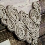 Hot glue fabric flowers into a heart shape