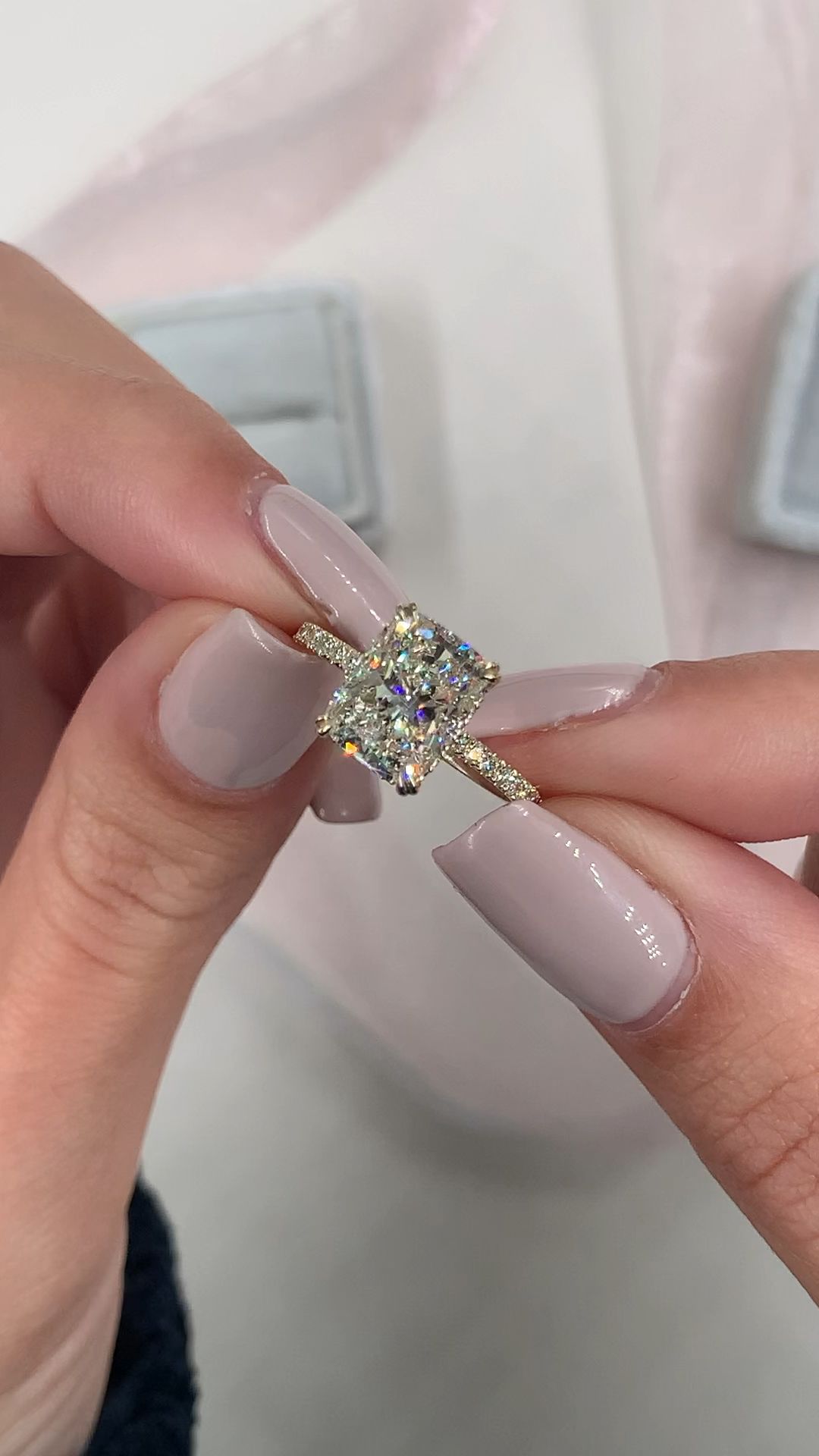 The most beautiful elongated cushion cut m. Features a double prong setting, hidden halo side stone setting in 14k yellow gold