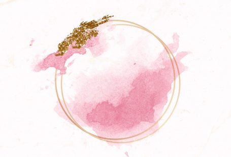 Gold round frame on pink watercolor background vector