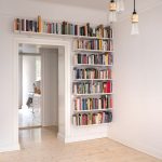 Great way to utilise space. Building open shelving around the door is a great way to maximise storage in a small space