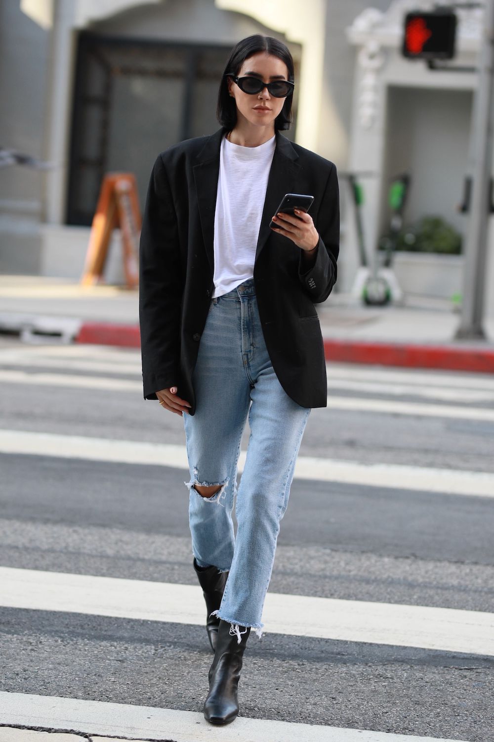 Brittany Xavier Spring Outfit Idea — Cat-Eye Sunglasses, White T-Shirt, Black Blazer, Distressed Jeans, and Black Ankle Boots