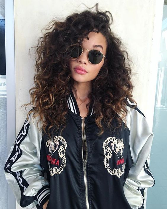 We asked Dana Tizzio, senior stylist at Butterfly Studio Salon, to give us tips on how to curl your hair, even when yours is super straight.