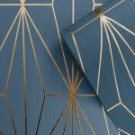 This stylish Kayla Geometric Wallpaper would make a great statement in most rooms of your home. The design features a geometric pattern of elongated triangles with a contemporary metallic bronze finish that catches and reflects the light. This is set on a matte deep blue background with a subtle lined texture. Easy to apply, this high quality wallpaper would look great when used to create a feature wall or to decorate an entire room. 10.05m (32.10ft) long x 53cm (21in) wide, 64cm pattern repeat.