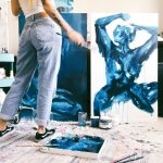 Charleston artist Samantha at work in her studio. Feminine figurative work portraying power and elegance