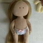 I want to show you a doll. What is she able to do.