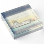 Square, free-standing acrylic block featuring high-quality back-mounted photographic prints. Perfect for a desk, bookcase, or windowsill. This is a pencil and water colour drawing of the aircraft carrier HMS Eagle in HongKong drawn by Keith Bacon the renowned British marine artist.