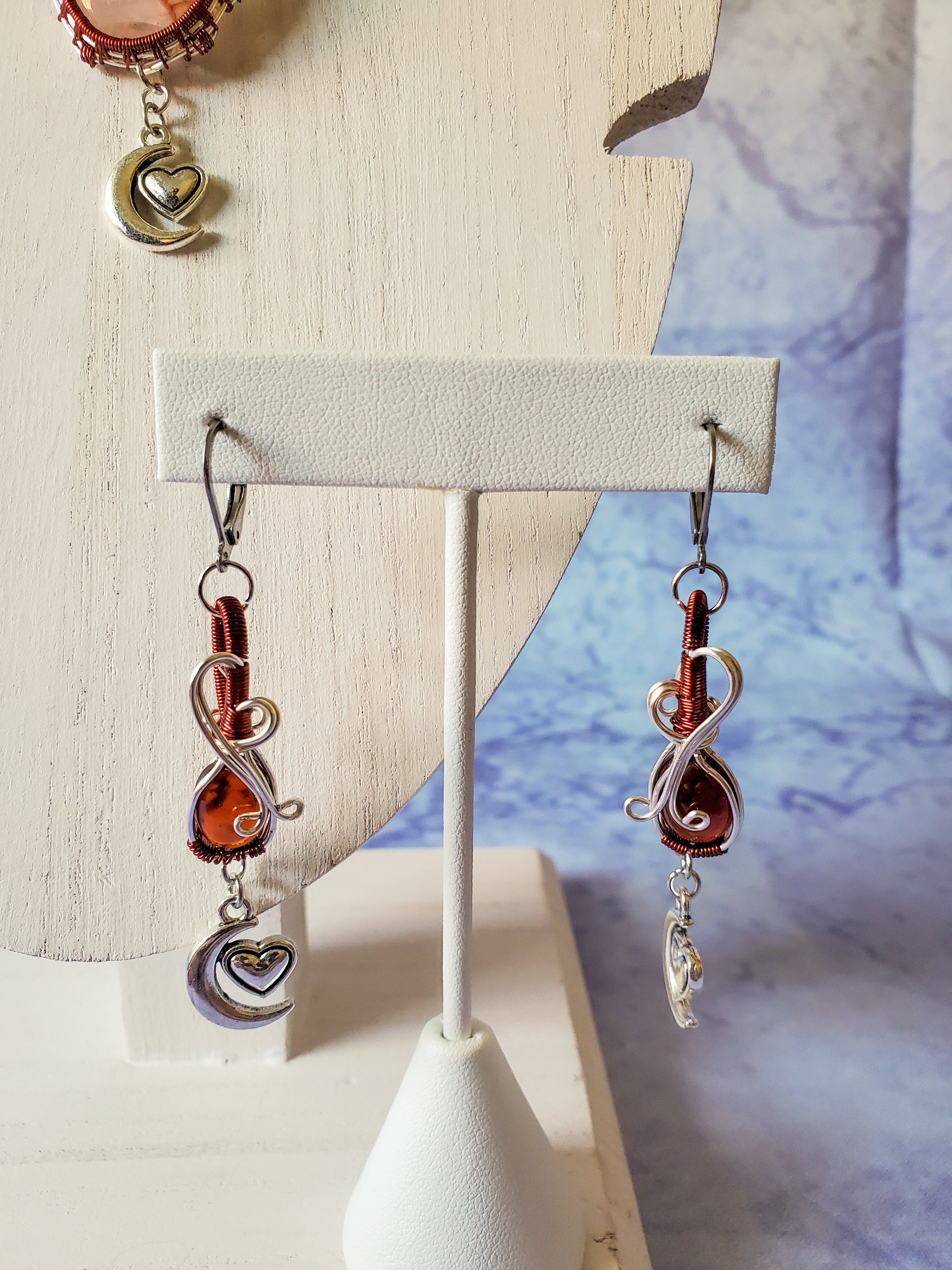 Cherry Quartz with Garnet accent Cherry Quartz is excellent at healing emotional wounds and can help sooth anger and tension. Cherry Quartz has all the properties of Quartz and is great for the heart chakra. Garnet Earrings Garnet cleanses and re-energises the chakras. It revitalises, purifies and balances energy, bringing serenity or passion as appropriate. Inspires love and devotion. Garnet balances the sex drive and alleviates emotional disharmony. It activates and strengthens the survival instinct, bringing courage and hope.