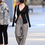 Emily Ratajkowski Wore an Ab-Baring Sexy Cardigan With These Famously Comfy, Under-$50 Sneakers