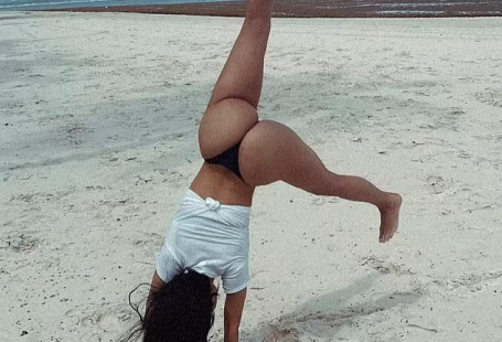 Kim Kardashian wows in thong bikini as she does cartwheels