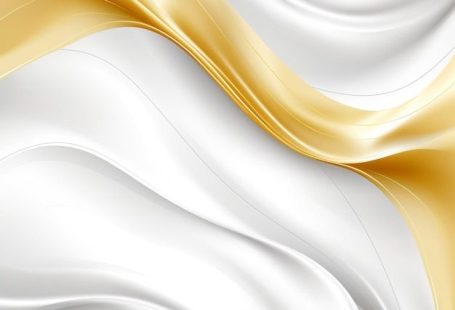 Premium Photo | A white and gold fabric background with a white background.