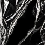 Free Photo | Wrinkled plastic wrap texture on a black background