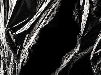 Free Photo | Wrinkled plastic wrap texture on a black background