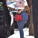 Amber Rose flaunts hourglass curves in crop top and painted on jeans
